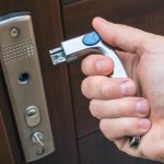 Man holding a broken door handle