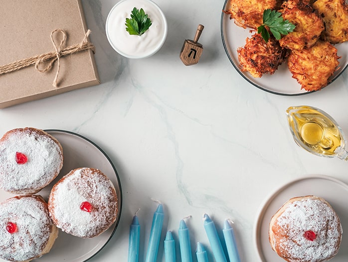 Flat lay of traditional Hanukkah foods.